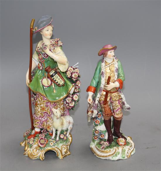 Two Chelsea gold anchor figures of a shepherdess and a huntsman, c.1765, 27.5 and 22.5cm